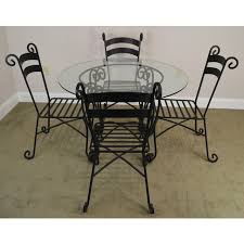 Featuring a wrought iron table base and hardwood table top, this bar height amish dining table is casual yet sophisticated. Wrought Iron 5 Piece 42 Round Glass Top Bistro Dining Set Chairish