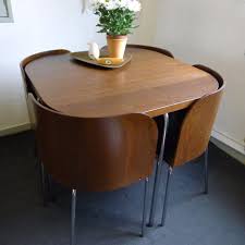 Use this table as extra counter space when it's folded up, and slide out the leaves to make dining a bit easier. Space Saving Folding Dining Table