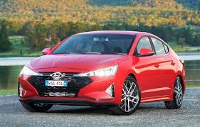 A black paint job brought the elantra's angular headlight, fog light, and wheel designs into stark relief while adding strong contrast to this trim level's chrome grille, beltline, and logo detailing. 2020 Hyundai Elantra Sport Premium Black Four Door Sedan Specifications Carexpert