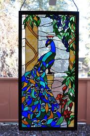 Contemporary color blocking adds an art deco touch to a desk lamp. Peacock Stained Glass Window