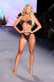 MIAMI BEACH, FLORIDA - JULY 09: Sierra Skye Walks The Runway As Oh Polly  Launch New Swimwear Brand Neena Swim For Miami Swim Week Paraiso Miami  Beach At The Paraiso Tent On