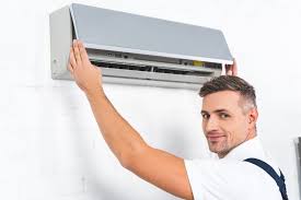 Insert air conditioner unit into wall sleeve and attach ground wire. How To Hide Ac Unit Around The Home A Guide Every Last House Plan
