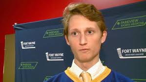 Homestead's Carter Roach, Drew Arnold, and coach DJ Fisher at HS hockey  media day