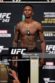 Brandon moreno leon edwards vs.тnate diaz demian maia vs. Https Media Gettyimages Com Photos Israel Adesanya Of New Zealand Poses On The Scale During The Ufc 243 Picture Id1179070813 S 2048x2 Ufc Israel Adesanya Mma