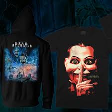 Remember: whatever happens, don't scream. 💀 New officially licensed DEAD  SILENCE collection haunts you this Tuesday at 5 PM EST! Swipe to see! 👀  Get ready for spooky new tees, zip-up hoodies,