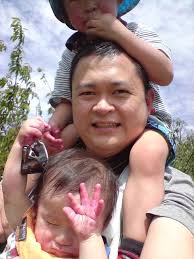 Liam's hand stained with cherry juice, Isaac still eating …