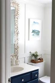 Again, mara sanded the whole thing down and started by painting the cabinets white using some primer and paint spray. How To Make An Oyster Shell Mirror Shine Your Light