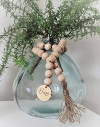 How To Style Your Wood Bead Garland Beauty For Ashes Wood Bead Garland Wood Beads Diy Wooden Bead Garland