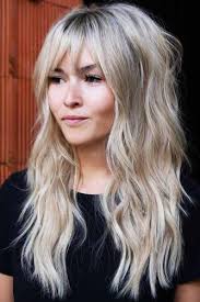 The style and cut work better on lengthy hair with a sleek, straight texture. Long Wavy Blonde Shag With Bangs Longhair Wavyha Hairs London