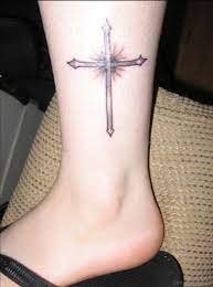 Colored rosary tattoo on foot. 55 Antic Cross Tattoos For Leg