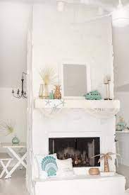 The white painted bricks of this fireplace can make the wood and fire stand out as a pop of color in an otherwise the stone complements the wood in the room, and the fireplace is clearly the centerpiece. Painting A Stone Fireplace Guide How To Paint A Fireplace