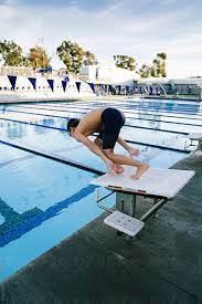 The individual 3m springboard and 10m platform events include three rounds of competition (preliminary, semifinal. Athlete Leaping From Diving Board Into An Olympic Size Pool By Curtis Kim Swimming Diving
