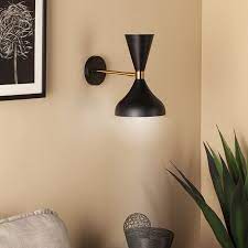 Contemporary wall sconces are great for small spaces or high traffic areas such as hallways,stairwells, kitchens, or bathrooms, if you're looking to add light, while also saving space. Axella Indoor Decorative Wall Sconce Black And Antique Brass Walmart Com Decorative Wall Sconces Gold Wall Sconce Brass Wall Light