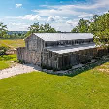 With nearly thirty two acres in one of Southeast Fort Myers' best  locations, this countryside listing paints the perfect landscape for a  wedding venue. The 4,000 square foot barn is truly spectacular,