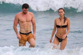 Bradley cooper straps daughter to chest on family outing with irina. Liam Hemsworth And Girlfriend Sizzle Beachside And More Star Snaps Page Six