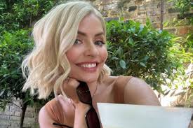 Holly Willoughby looks incredible as she poses in garden with huge cocktail 