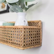 The shelf is made from solid bamboo wood simply slides on to the metal frame once it is attached to your wall. Woven Bamboo Wall Shelf