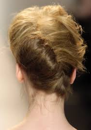 Sideways french twist, a version of the chic updo for more details see this post The 90s French Twist Is Back Thefashionspot