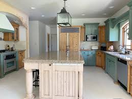 When you hire a pro to refinish your bathroom or kitchen cabinets, that price includes labor, materials like stain and top coat and minor repairs. Colors We Re Considering For Our Phase 1 Kitchen Cabinets Makeover Chris Loves Julia