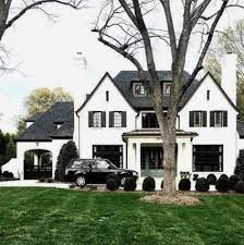 Black metal roof accentuates the black and white siding. 55 Ideas House White Brick Black Shutters Dream House Exterior House Exterior House Goals