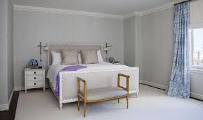 The guest bedroom of an eclectic adriatic home features a punchy purple accent wall, which backs a woven screen from burundi that serves as the headboard. Gray Bedroom With Purple Accents Transitional Bedroom