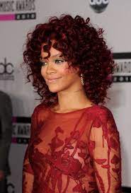Rihanna curly hairstyles are big inspiration for women all around the world. Rihanna Is Ravishing In Coiled Medium Curls Red Curly Hair Hair Styles Rihanna Hairstyles
