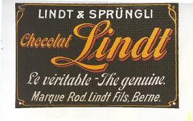 Lindt History This Enamel Sign From The 1920 S Is Evidence Of The Battle Against A False Lindt Bra Lindt Chocolate Dove Chocolate Discoveries Dove Chocolate
