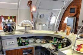 To get a beverage, a metal shield device is needed to be lifted. This Is What Happens When You Fly Emirates Business Class