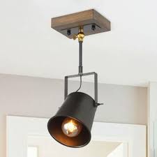 The lights are suspended from an old wooden pallet affixed to the ceiling. Farmhouse Track Lighting Lighting The Home Depot