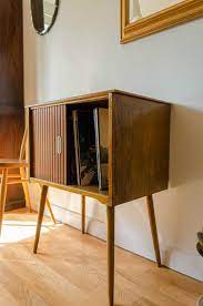 This midcentury modern entertainment cabinet is a multifunctional piece designed with style. Vintage Mid Century Modern Teak Vinyl Record Storage Cabinet Sliding Doors 1950s Mid Century Modern Storage Record Storage Cabinet Modern Storage Cabinet