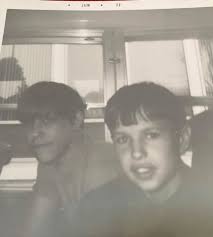 What are the names of the two random people watching the scene?