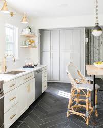 gray herringbone floors & brass hardware