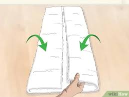 A handy bar below holds hand towels. 3 Ways To Arrange Towels On A Towel Bar Wikihow