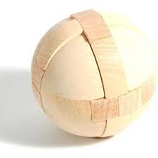 On each side of the string are a wooden disk and a pull the ring over the ball on the right side of the post to free it from the puzzle, thereby solving it. Wooden Ball Puzzle Boon Companion Toys