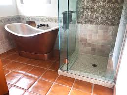 The smaller tiles mixed in among larger marble slabs create a striking juxtaposition. Mexican Ceramic Tile In Bathroom Walls And Paver Floor Tiles Tile Floor Ceramic Tiles Decorative Ceramic Tile