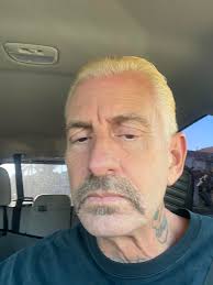 How to seem less gay after cutting beard?