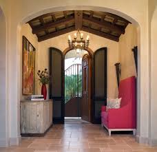 With a separate hinged top and bottom, maria's master bedroom door features iron scrollwork within a picturesque spanish arch on top, accompanied by a raised panel bottom. Taking The Long View Trends