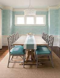 Gray Bamboo Dining Chairs With Turquoise Blue Leather Seat Cushions Flank A Trestle Dining Table An Aqua Dining Rooms Bamboo Dining Chairs Dining Room Makeover