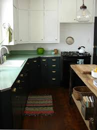I mixed the milk paint powder with water using a stick, then mixed it with the same quantity of bonding agent. Expert Tips On Painting Your Kitchen Cabinets