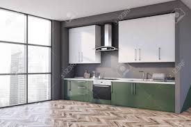 Oh boy this is a tough one for me as the bathroom mirrors look lovely but the white bathroom cabinets are amazing too. Corner Of Modern Kitchen With Gray Walls Wooden Floor Green Countertops With Built In Sink And Cooker And White Cupboards 3d Rendering Stock Photo Picture And Royalty Free Image Image 138087997