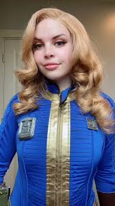 Lucy Cosplay from Fallout with Pip Boy and Vault Dweller Costume