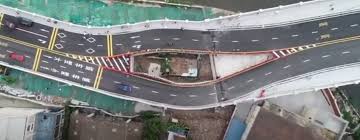 Chinese Government forced to build freeway around tiny house after owner  refused to move - Community - UNILAD