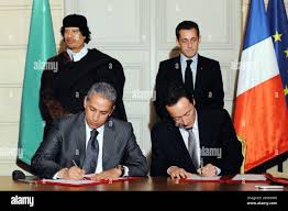 Afriqiyah Airways CEO Sabri Abdullah, Chief Operating Officer of Airbus  Fabrice Bregier, President Nicolas Sarkozy and Libyan leader Moammar  Gadhafi attend a signing ceremony at the Elysee Palace in Paris, France on