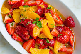 strawberry and orange salad with citrus syrup fresh mint