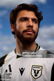Lachlan Rose of the Bulls heads the ball during a Macarthur FC... News  Photo