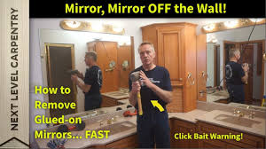 First, wedge a few wooden shims between the wall and the mirror, using a hammer to help if needed, placing them wherever they fit around the entire perimeter. How To Remove Glued On Mirrors Youtube
