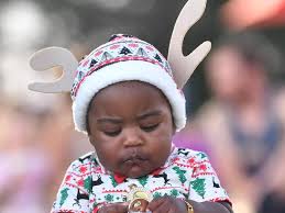 Adorable bubs and kids dressed as reindeers, elves, angels at Townsville  Christmas in the Park