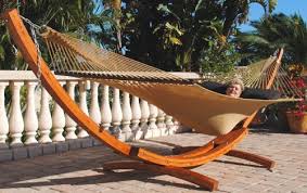 Do you like the idea of having a lounge area in your backyard with a hammock? The Caribbean Cypress Arc Hammock Stand