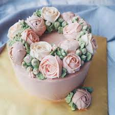 This floral buttercream cake has hundreds of… color buttercream: Pastel Vintage Buttercream Roses And Ranunculus And Buds Buttercream Cake Buttercream Flower Cake Buttercream Cake Designs Flower Cake