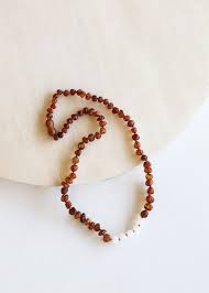 You will have the energies of success, protection, healing, spiritual, peace, and love. Raw Cognac Amber Moonstone Necklace Canyonleaf